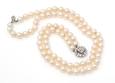 Lot 105 - A cultured pearl necklace with diamond clasp