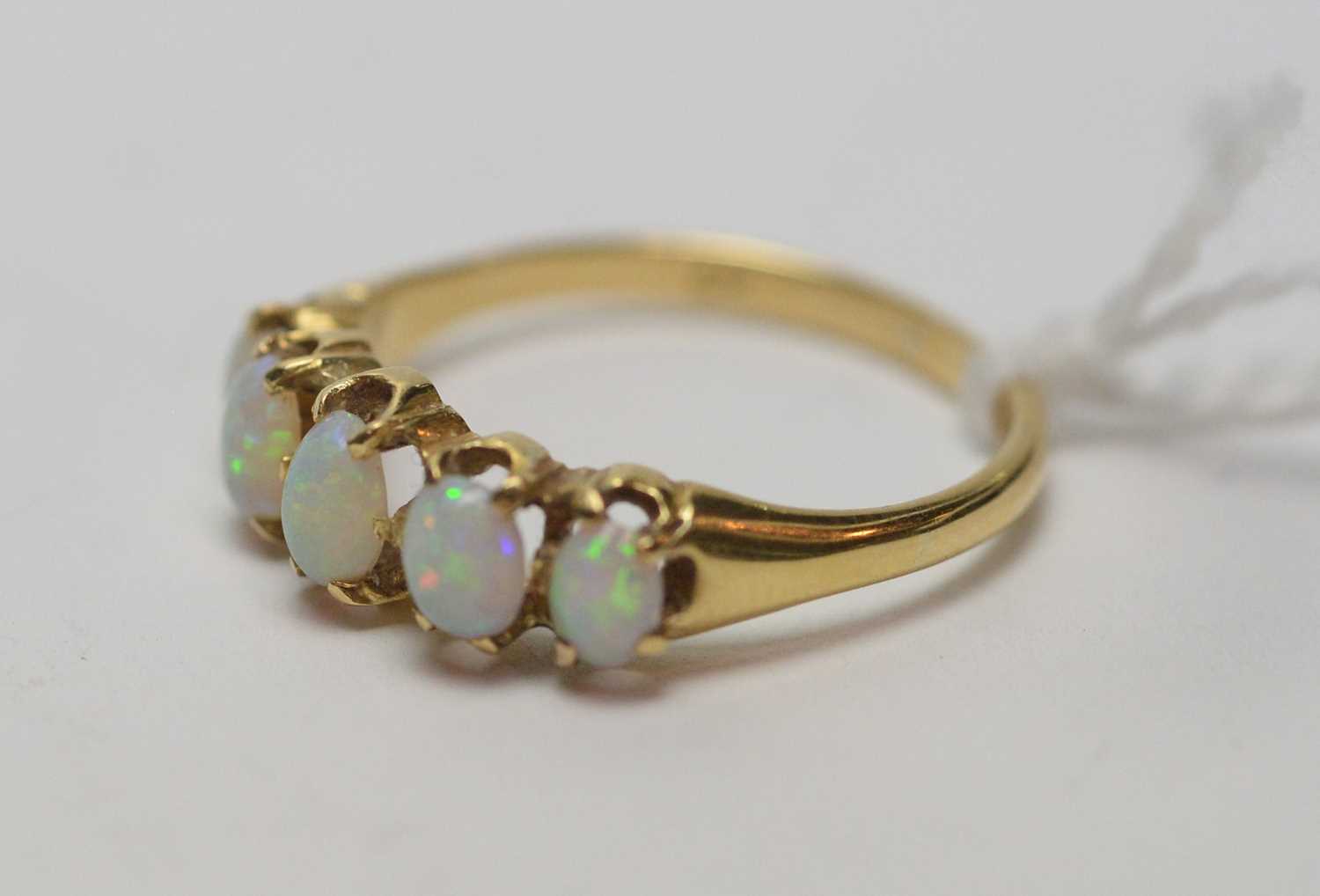 Lot 191 - A five stone opal ring