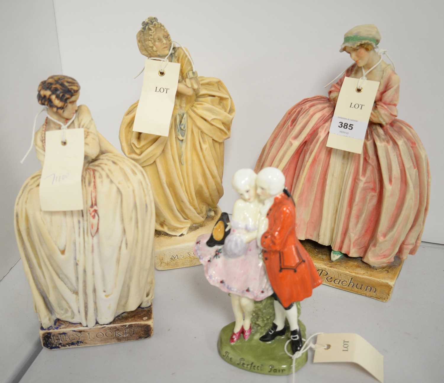 Lot 385 - A Royal Doulton ceramic figure and three others