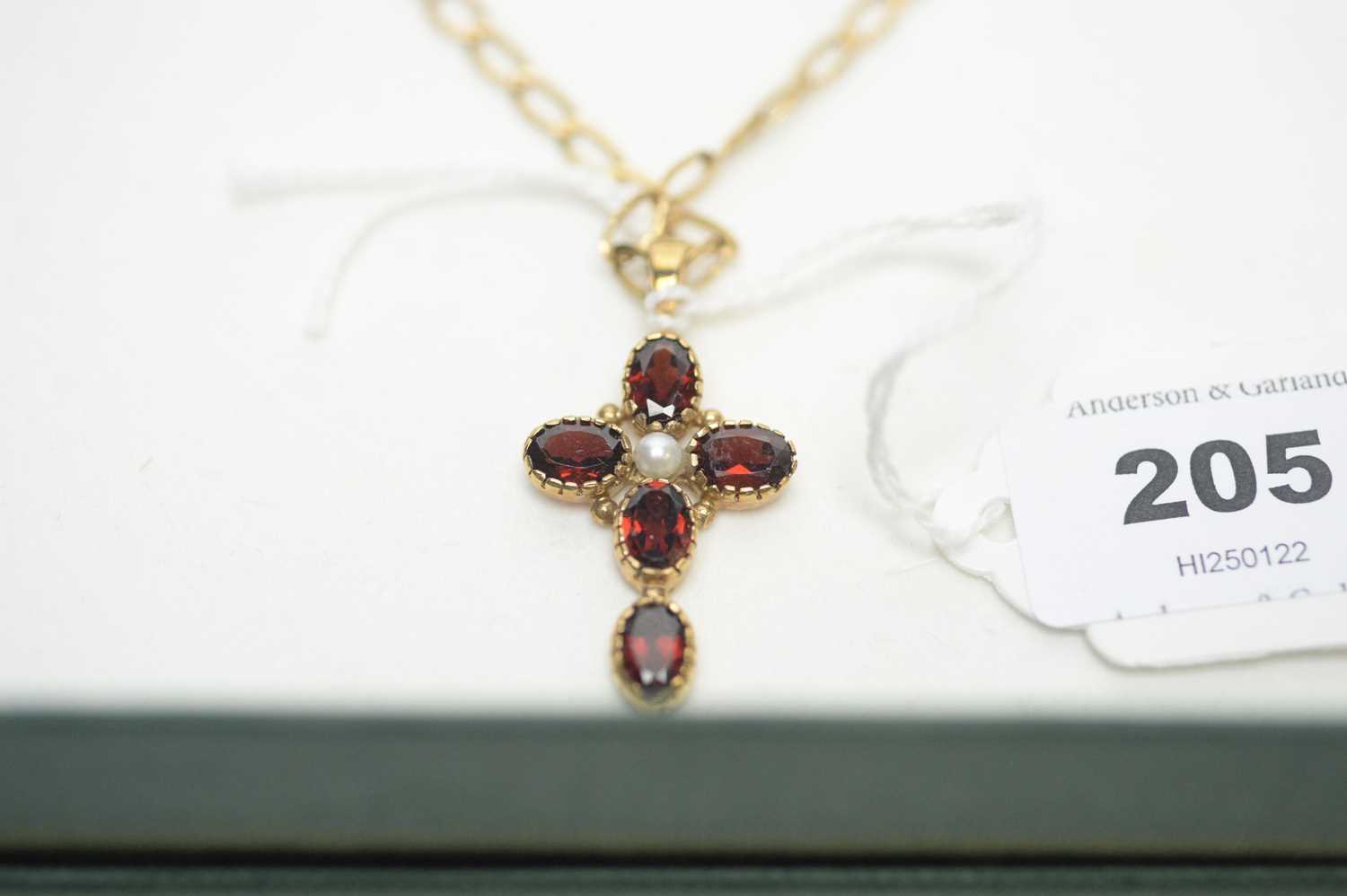 Lot 205 - A 9ct gold garnet and pearl cruciform pendant and earrings