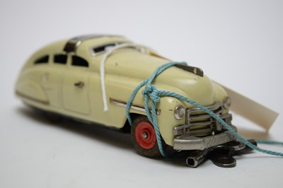 Lot 371 - Two Schuco and a French Brevete model cars.