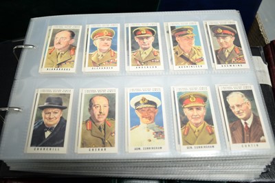 Lot 517 - A collection of eight albums of cigarette cards, and a postcard album