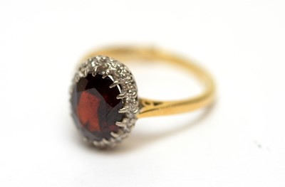 Lot 240 - A garnet and diamond cluster ring