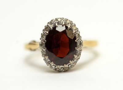 Lot 240 - A garnet and diamond cluster ring