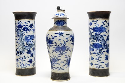 Lot 450 - A pair of Chinese crackle glaze vases and another.