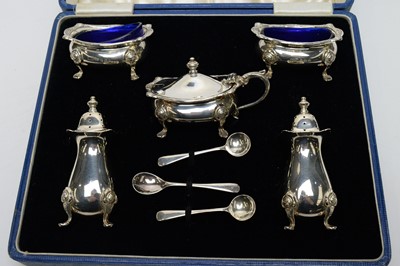 Lot 181 - A George VI silver cased cruet set and coffee spoons