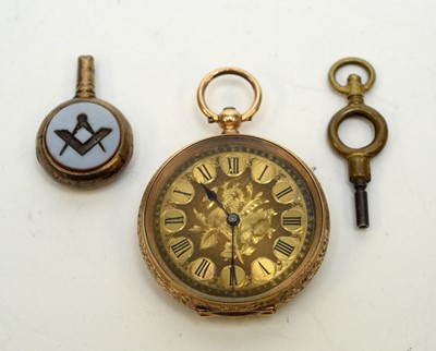 Lot 132 - An antique yellow-metal fob watch and key