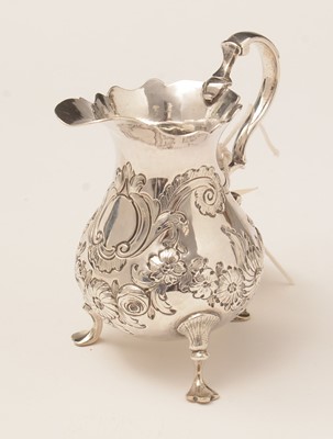 Lot 188 - A George II silver cream jug