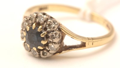Lot 103 - An 18ct gold, sapphire and diamond ring