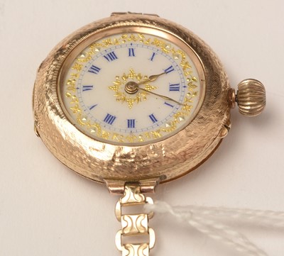 Lot 115 - An early 20th Century yellow-metal transitional fob to wristwatch