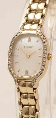Lot 159 - A lady's 9ct gold Tissot wristwatch with diamond-set bezel