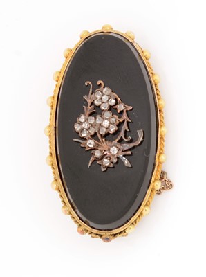 Lot 79 - An onyx and diamond mourning brooch