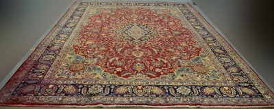 Lot 89 - A Persian Mashad carpet with decorative floral design