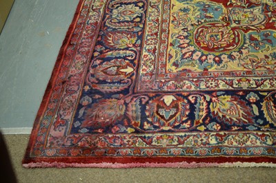 Lot 89 - A Persian Mashad carpet with decorative floral design