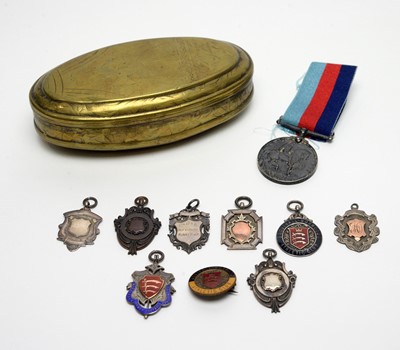 Lot 204 - Silver fob medals, a First World War medal, and a tobacco tin