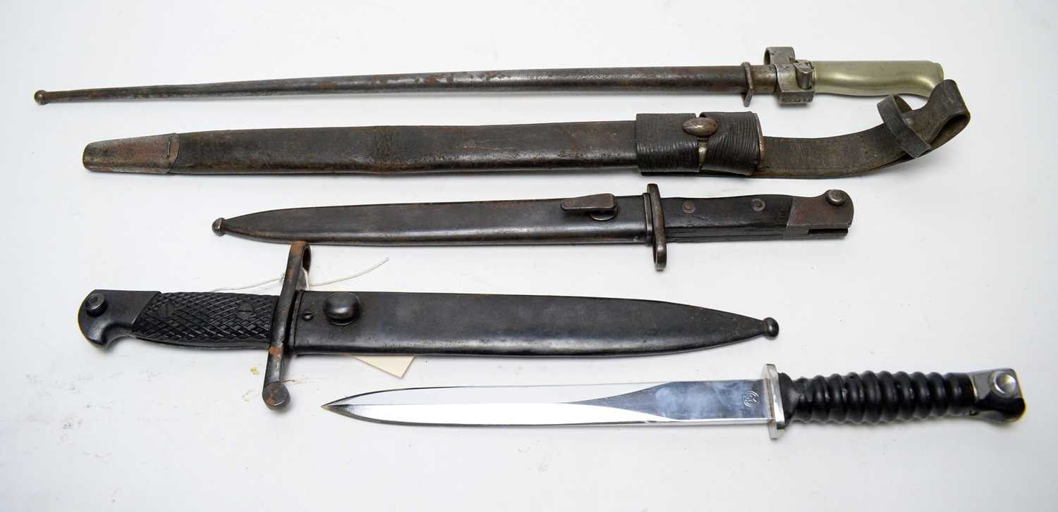 Lot 448 - Four bayonets, various countries, and a scabbard.