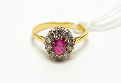 Lot 146 - A ruby and diamond dress ring