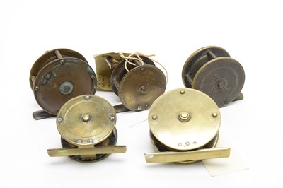 Lot 571 - Five late 19th/early 20th Century all brass reels