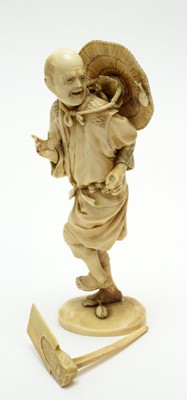 Lot 487 - Japanese ivory okimono of a farmer.