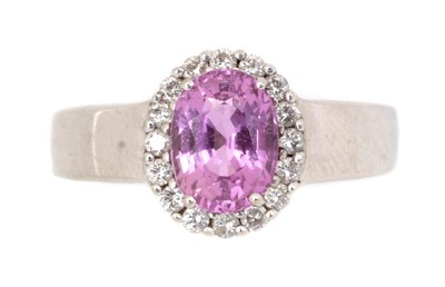 Lot 119 - A pink sapphire and diamond ring