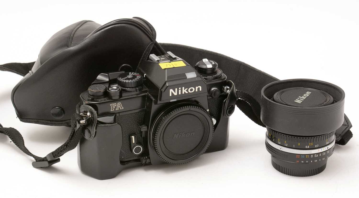357 - A Nikon camera and lens.