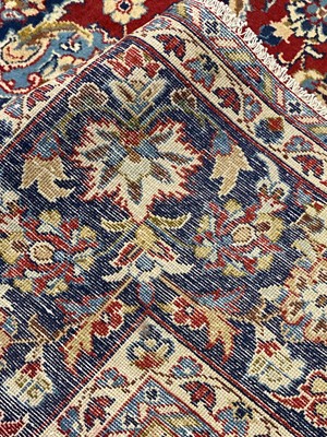 Lot 82 - A Kashan carpet.