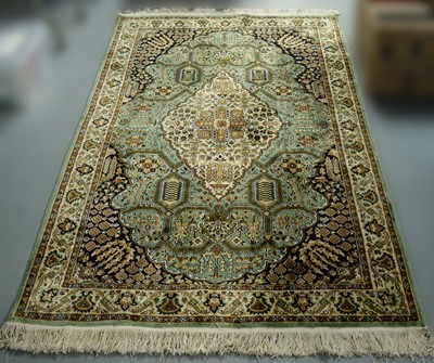 Lot 85 - A Persian part silk rug.