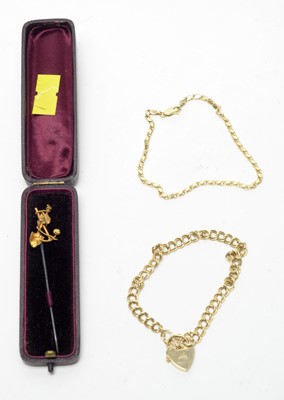 Lot 156 - An antique "gold rush" tie pin, and two bracelets