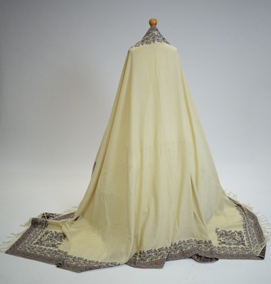 Lot 802 - A 19th Century woven cream wool long shawl