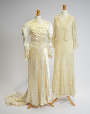 Lot 810 - An early 1930s champagne lace tea gown, and a wedding dress