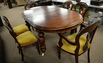 Lot 23 - Victorian-style extending dining table; and a set of six chairs.