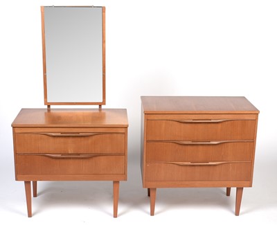 Lot 355 - Mid-Century teak chest of drawers and matching dressing chest.