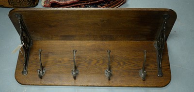 Lot 472 - A late19th/early 20th Century oak wall-mounted coat rack