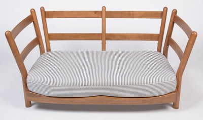 Lot 412 - Attributed to Ercol: a modern beech wood two-seater sofa.