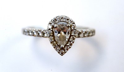 Lot 130 - A pear-cut diamond cluster ring