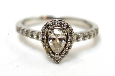 Lot 130 - A pear-cut diamond cluster ring
