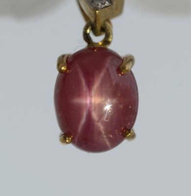 Lot 67 - A star-ruby and diamond pendant