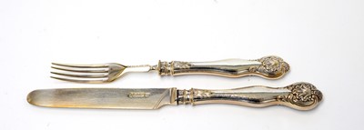 Lot 150 - A William IV silver dessert knives and forks in canteen