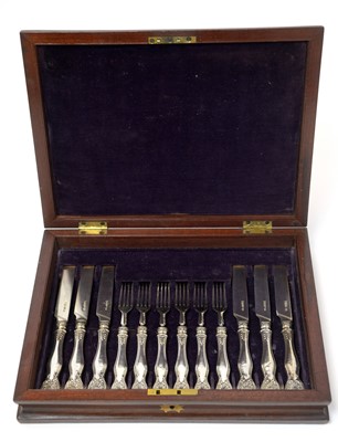 Lot 150 - A William IV silver dessert knives and forks in canteen