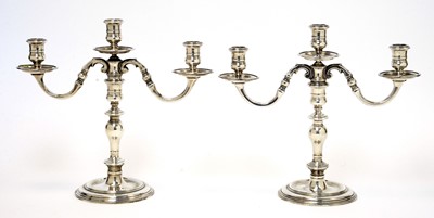 Lot 161 - A pair of Elizabeth II silver three branch candelabra