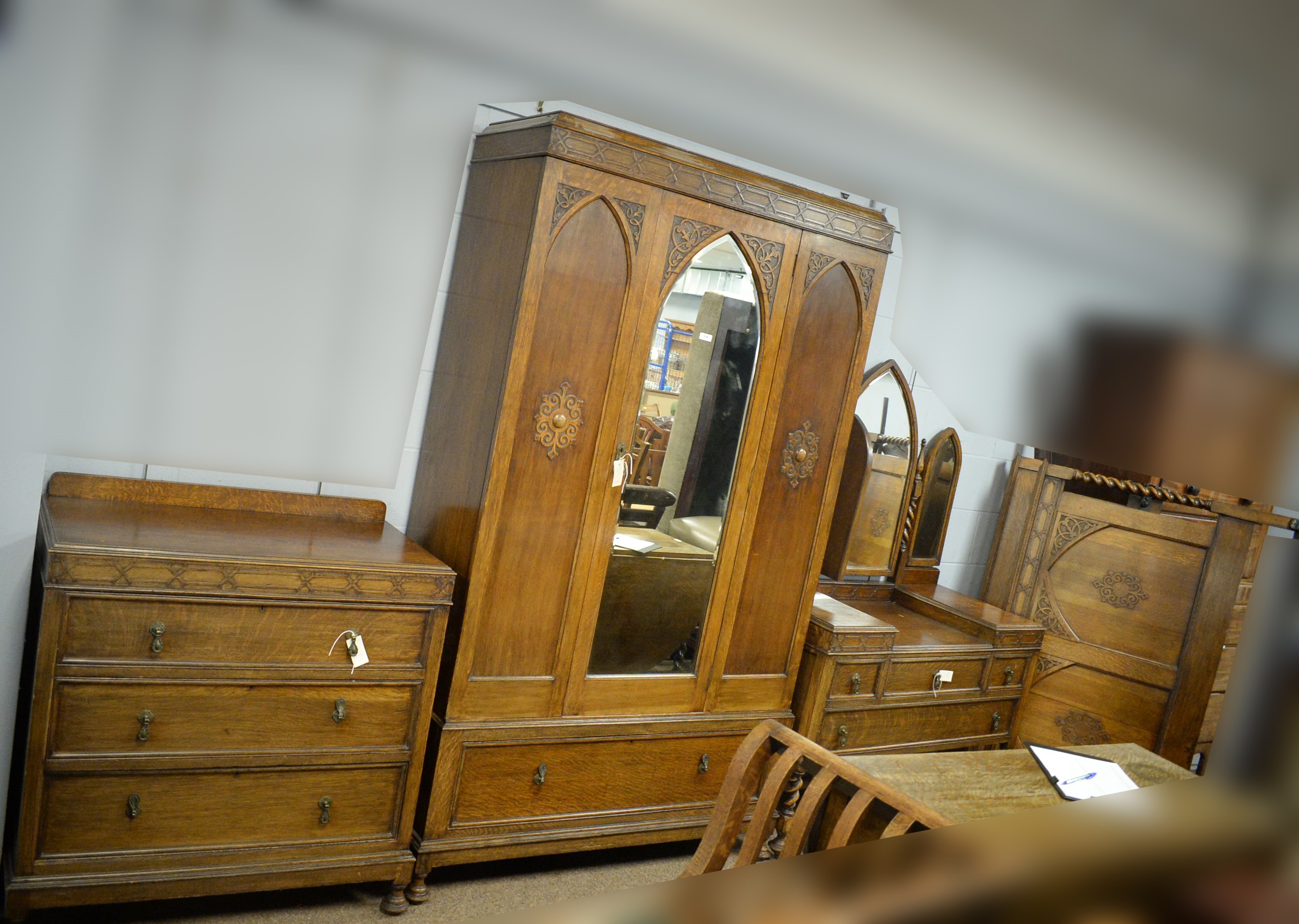 Lot 114 Early 20th C fourpiece oak bedroom suite.