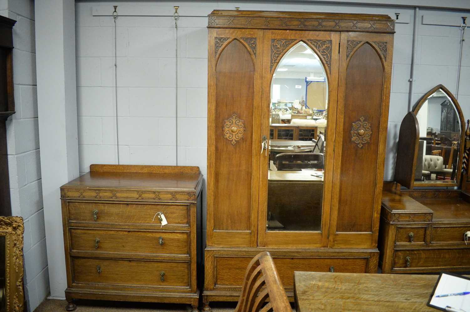 Lot 114 Early 20th C fourpiece oak bedroom suite.