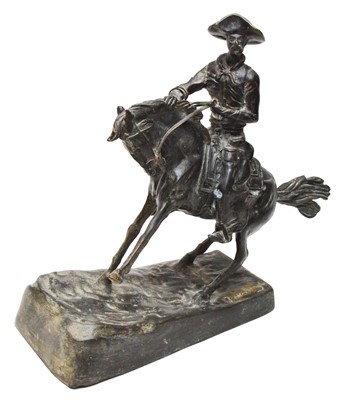 Lot 577 - After Frederic Remington: a bronze cowboy on horseback