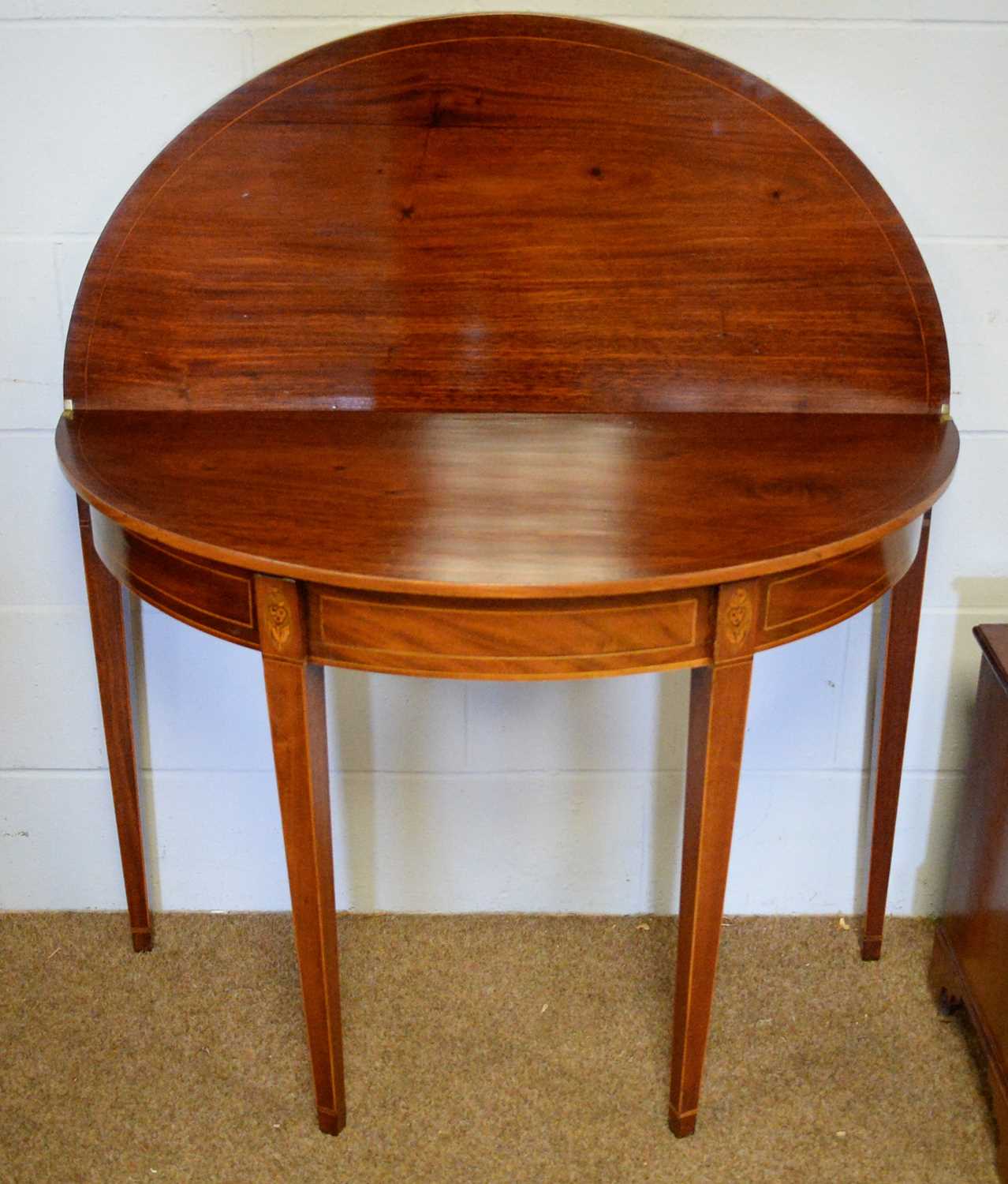 Lot 74 - A Georgian inlaid mahogany demi-lune tea table