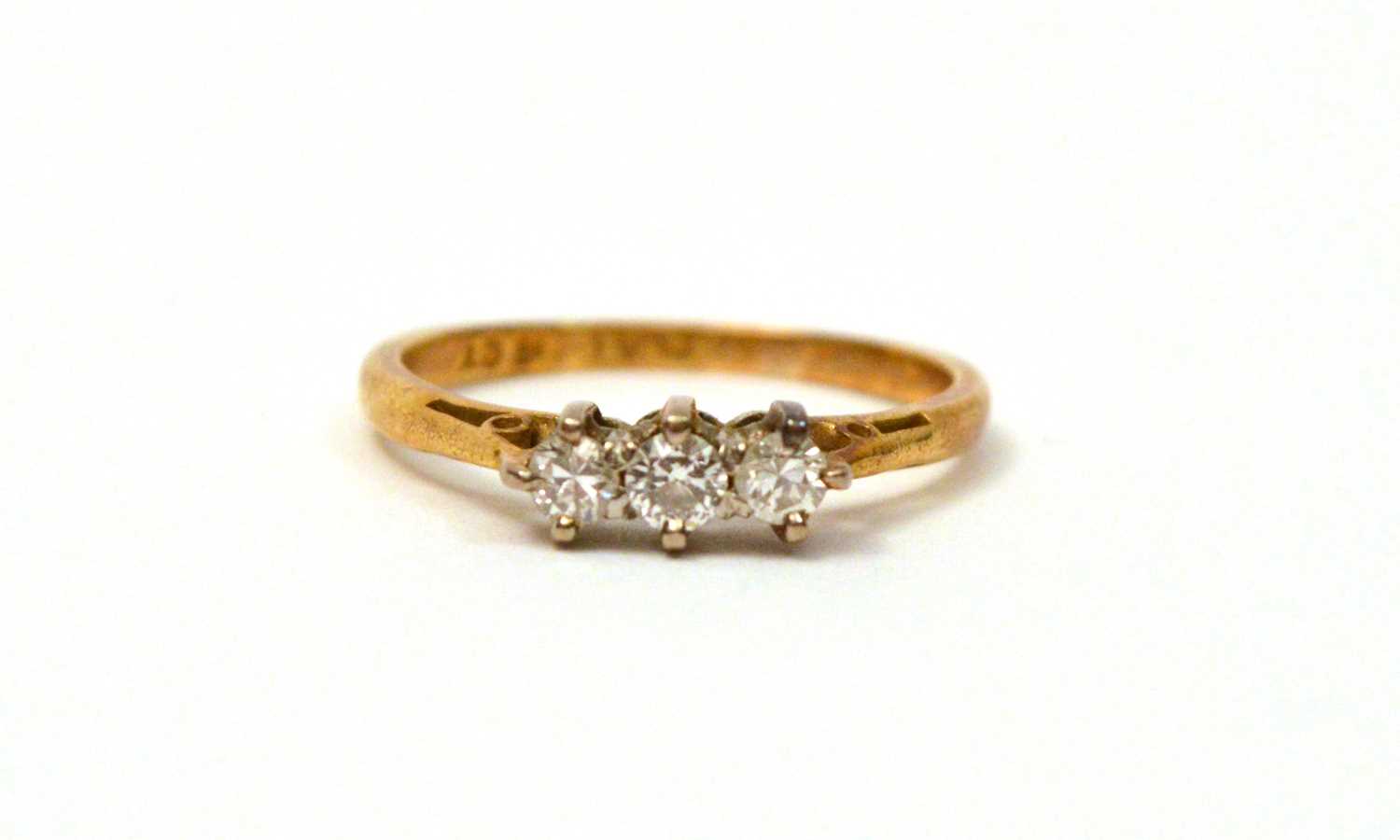 Lot 116 - A three stone diamond ring