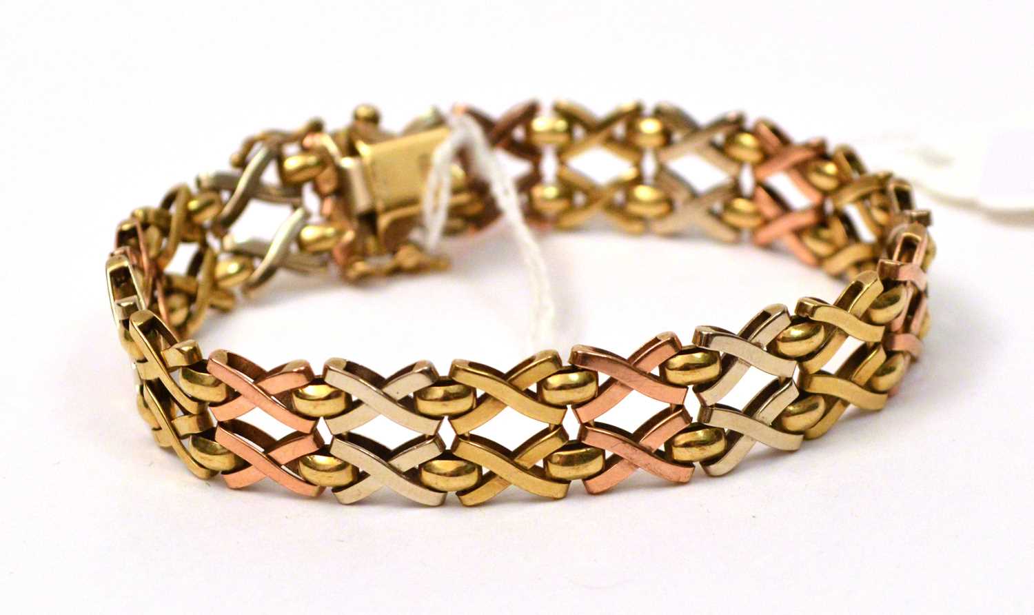 Lot 137 - A 9ct yellow, white and rose gold bracelet