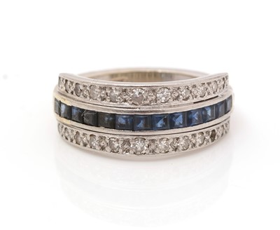 Lot 300 - A diamond and sapphire dress ring