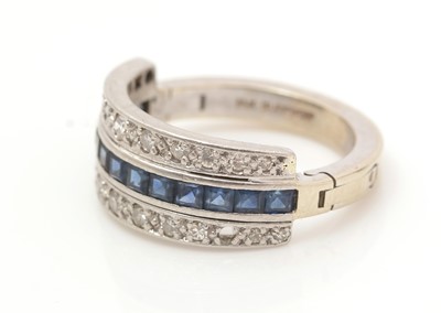 Lot 427 - A diamond and sapphire dress ring
