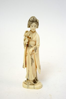 Lot 499 - Japanese ivory okimono Bijin and flower