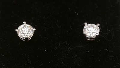 Lot 297 - A pair of diamond stud earrings